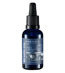 A dark blue bottle labeled Particle Beard Oil, Men's Formula Daily Care with a black pump top.