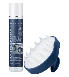 Bottle of Particle Hair and Scalp Cream and scalp brush standing upright.